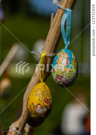 Easter eggs hanging on a branch Easter eggs hanging on a branch 123731859