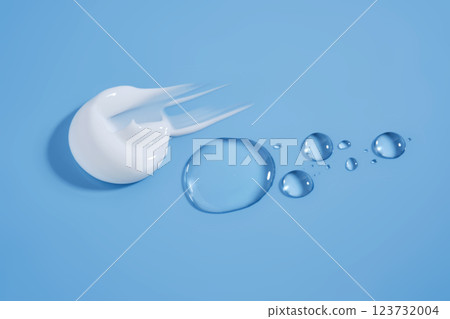 A smear of white cream And a drop of serum on a blue background. A smear of white cream And a drop of serum on a blue background. 123732004