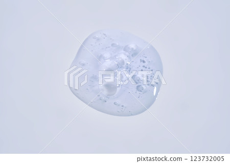 A drop of blue serum with bubbles. A drop of blue serum with bubbles. 123732005