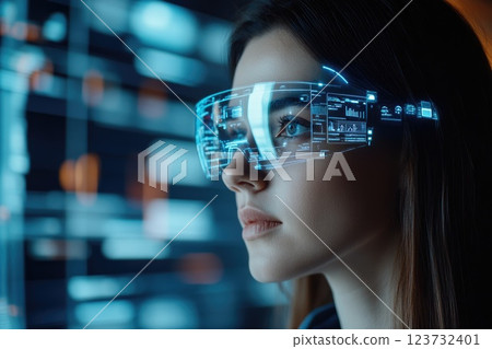 A woman wearing a pair of virtual reality goggles A woman wearing a pair of virtual reality goggles 123732401