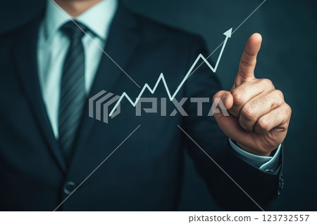 Businessman Pointing at Investment Growth Graph with Professional Background Businessman Pointing at Investment Growth Graph with Professional Background 123732557