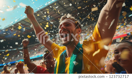A man is celebrating with confetti falling around him 123732717