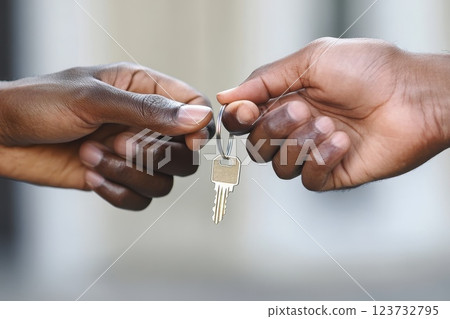 Real Estate Agent Handing Over House Keys to New Homeowner in Emotional Moment Real Estate Agent Handing Over House Keys to New Homeowner in Emotional Moment 123732795