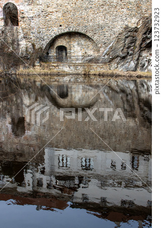 Rock and river Vltava, Cesky Krumlov, Czechia 123732923