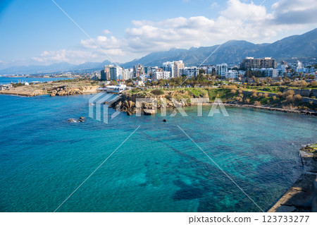 A panoramic view of the city from the fortress in Girne, Northern Cyprus. The historic walls overlook the urban landscape, blending medieval architecture with modern life 123733277