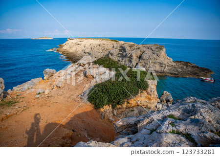 View of Kape Apostolos and Kleides Islands at the very eastern tip of the Karpasia Peninsula in the Turkish Republic of Northern Cyprus. Most easterly point on mainland Cyprus. View of Kape Apostolos and Kleides Islands at the very eastern tip of the Karpasia Peninsula in the Turkish Republic of Northern Cyprus. Most easterly point on mainland Cyprus. 123733281