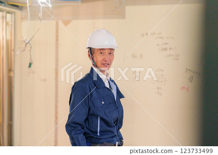Male carpenter working at an apartment renovation site Male carpenter working at an apartment renovation site 123733499