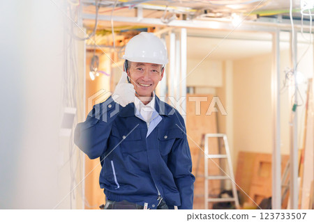 Male carpenter working at an apartment renovation site Male carpenter working at an apartment renovation site 123733507