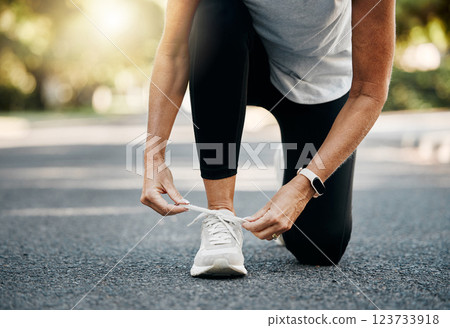 Fitness, running and shoes of woman in road for morning workout for health, wellness and workout. Sports, exercise and energy with sneakers of senior runner in neighborhood for marathon training Fitness, running and shoes of woman in road for morning workout for health, wellness and workout. Sports, exercise and energy with sneakers of senior runner in neighborhood for marathon training 123733918