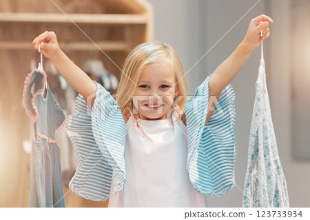 Girl child, choice or change clothes in fashion brand retail store shopping sale happy for buying decision at mall. Smile, happiness and excited young kid customer choose designer clothing dress shop Girl child, choice or change clothes in fashion brand retail store shopping sale happy for buying decision at mall. Smile, happiness and excited young kid customer choose designer clothing dress shop 123733934