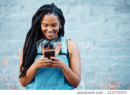 Black woman with 5g smartphone for social media typing, digital chat app or check location on blue wall background space mockup. Teenager gen z girl on cellphone for youth online website networking 123733955
