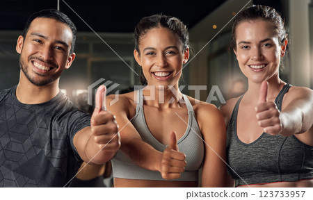 Fitness, portrait and thumbs up with friends in gym together for motivation, support or thank you. Exercise, smile and team building with like or yes emoji of people in health club for success Fitness, portrait and thumbs up with friends in gym together for motivation, support or thank you. Exercise, smile and team building with like or yes emoji of people in health club for success 123733957