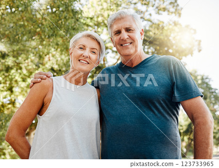 Old couple, hug and nature portrait smile outdoors, park or outside on break after running, walk or exercise. Health, workout and elderly man and woman, walking or spend quality fitness time together 123733965