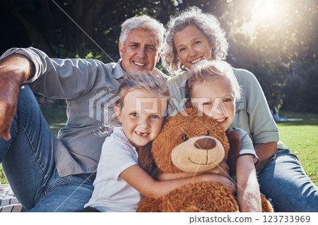 Family, children and teddy bear with a girl, grandparents and sister on the grass in a nature park during summer. Kids, haooy and love with senior man, woman and grandchildren outdoor in the day Family, children and teddy bear with a girl, grandparents and sister on the grass in a nature park during summer. Kids, haooy and love with senior man, woman and grandchildren outdoor in the day 123733969