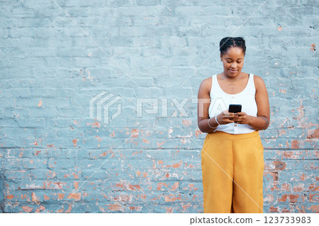 Black woman, fashion and phone by mock up wall in Nigerian city for marketing, advertising or sales deal promotion mockup. Smile, happy or trend student with mobile technology for social media search Black woman, fashion and phone by mock up wall in Nigerian city for marketing, advertising or sales deal promotion mockup. Smile, happy or trend student with mobile technology for social media search 123733983