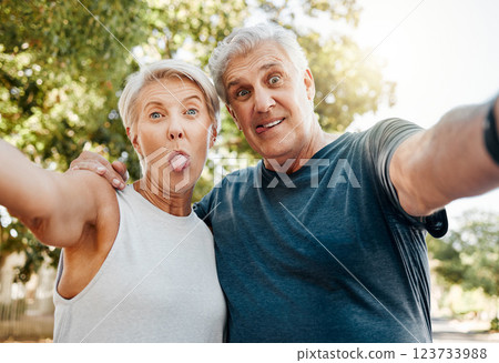 Fitness senior couple with selfie and outdoor hiking, exercise or workout together for healthy, wellness or retirement lifestyle. Crazy, adventure park training with elderly people in nature portrait Fitness senior couple with selfie and outdoor hiking, exercise or workout together for healthy, wellness or retirement lifestyle. Crazy, adventure park training with elderly people in nature portrait 123733988