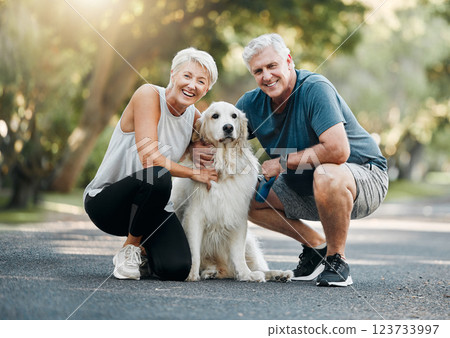 Happy senior couple, walking dog in nature park and smile bonding with their golden retriever together. Healthy living in retirement, being physically active by exercising and relaxing time with pet Happy senior couple, walking dog in nature park and smile bonding with their golden retriever together. Healthy living in retirement, being physically active by exercising and relaxing time with pet 123733997