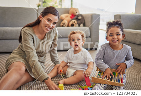 Mother, baby and child on carpet for education, learning and teaching in their living room home with happy portrait. Young mom from Mexico with kids play time, mindset growth development with puzzle 123734025