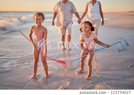 Children, fishing and beach with a girl, family and sister on the sand by the sea or ocean for fun and playing. Water, nature and kids playing outside during summer vacation, holiday or getaway Children, fishing and beach with a girl, family and sister on the sand by the sea or ocean for fun and playing. Water, nature and kids playing outside during summer vacation, holiday or getaway 123734027