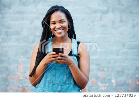 Happy black woman, portrait smile and phone in communication, texting and social media outdoors. African female smiling for 5g connection in Canada on mobile smartphone messaging in happiness outside 123734029