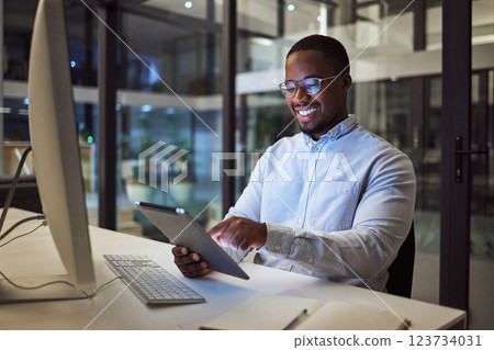 Businessman working on digital tablet late in office at night, happy and inspired by career goal. Motivation, management and vision by black entrepreneur excited by innovation and new company Businessman working on digital tablet late in office at night, happy and inspired by career goal. Motivation, management and vision by black entrepreneur excited by innovation and new company 123734031