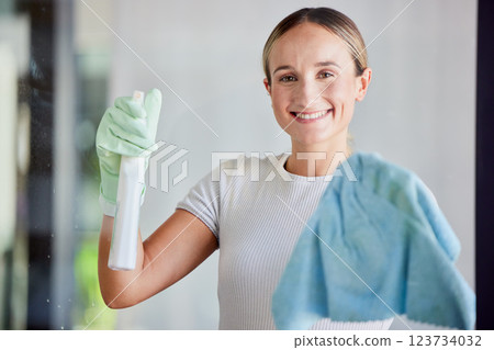 Window, cleaning service and woman in portrait with cloth cleaner product, spray bottle and gloves in home or office. Entrepreneur person in house with soap liquid, detergent for spring clean career 123734032
