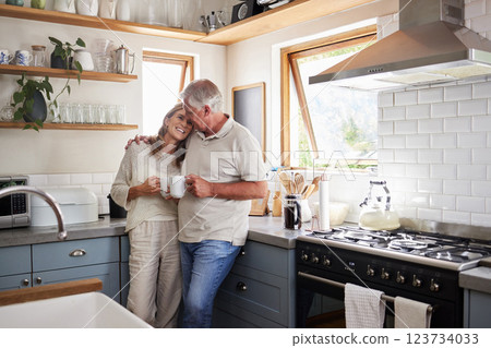 Love, kitchen and senior couple relax with cup of coffee, tea or hot drink while bonding and connect at home. Family, peace and elderly man and woman enjoy quality time, retirement and life together 123734033