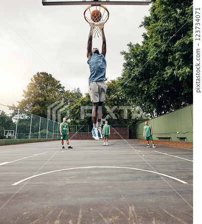 Basketball, player and winner on court jump, makes basket and score, celebration and victory playing against team. Competition, game day and dunk ball in net excited, practice and winning the game. Basketball, player and winner on court jump, makes basket and score, celebration and victory playing against team. Competition, game day and dunk ball in net excited, practice and winning the game. 123734071