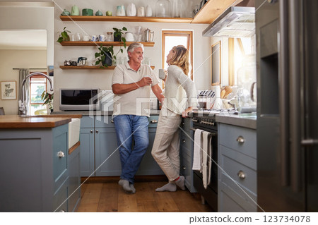 Relax, coffee and elderly couple in a kitchen, bonding and talking in their home together. Love, woman and mature man enjoying retirement and relationship indoors, casual conversation in the morning Relax, coffee and elderly couple in a kitchen, bonding and talking in their home together. Love, woman and mature man enjoying retirement and relationship indoors, casual conversation in the morning 123734078