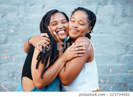 Happy, hug and black friends in the city while on summer vacation together in south africa. Happiness, smile and african women embracing, bonding with affection on the urban street on holiday. 123734082