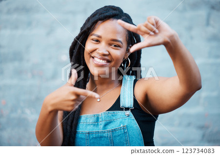Black woman, hands and finger frame showing smile, happiness and face against city building wall, mockup space or outside in Atlanta. Portrait of female model with fun or playful gesture for beauty Black woman, hands and finger frame showing smile, happiness and face against city building wall, mockup space or outside in Atlanta. Portrait of female model with fun or playful gesture for beauty 123734083