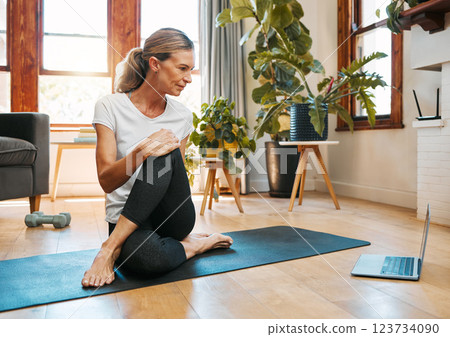 Yoga, zen and senior woman on laptop streaming training video, web yoga class or tutorial at home. Health, exercise and elderly female on tech pc, pilates mat and stretching, fitness and wellness. Yoga, zen and senior woman on laptop streaming training video, web yoga class or tutorial at home. Health, exercise and elderly female on tech pc, pilates mat and stretching, fitness and wellness. 123734090