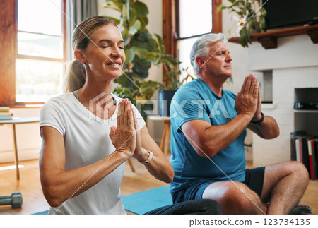 Meditation, wellness and yoga by elderly couple exercise and relax on a floor, bonding in a living room together. Zen, peace and fitness workout by mature man and woman exercising and doing cardio Meditation, wellness and yoga by elderly couple exercise and relax on a floor, bonding in a living room together. Zen, peace and fitness workout by mature man and woman exercising and doing cardio 123734135