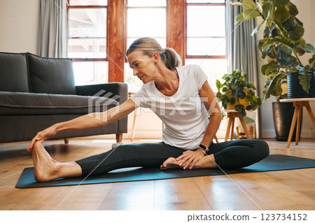 Fitness, health and pilates by elderly woman exercise and stretching on floor, wellness and relax in living room. Zen, yoga and meditation by senior female workout in home, healthy cardio practice Fitness, health and pilates by elderly woman exercise and stretching on floor, wellness and relax in living room. Zen, yoga and meditation by senior female workout in home, healthy cardio practice 123734152