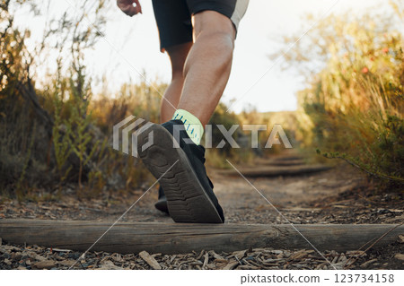 Legs, shoes or runner on nature path for cardio exercise, sports workout or marathon training on outdoor countryside. Fitness, motivation or wellness for walking man on freedom travel for body health Legs, shoes or runner on nature path for cardio exercise, sports workout or marathon training on outdoor countryside. Fitness, motivation or wellness for walking man on freedom travel for body health 123734158