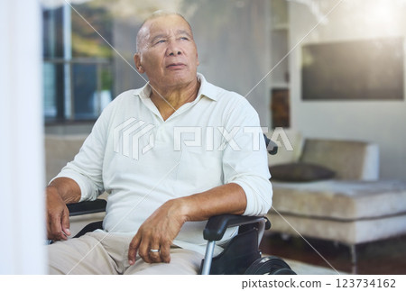 Disabled, sad and senior man thinking of accident in a wheelchair by the window in the living room in his house. Elderly man with depression, disability and retirement idea in a nursing home 123734162