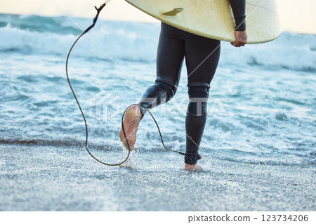Legs, surfboard man at beach and ocean waves for fitness, adventure and healthy lifestyle on Bali summer tropical vacation. Surfer running in sea water, relief of stress and surfing in wet suit. 123734206
