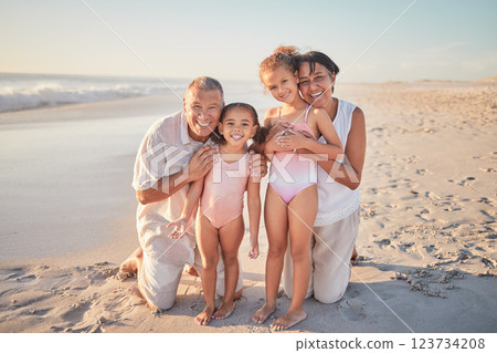 Grandparents with children, happy on beach on holiday and enjoying retirement. Grandpa, grandma and kids enjoy afternoon playing in ocean summer sun. Family love time together by the sea and sand 123734208