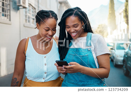 Happy black woman, friends and phone in social media communication, texting together outside an urban street. African women smiling for 5G connection in Canada browsing, chatting on mobile smartphone 123734209