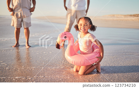 Beach, flamingo and child portrait on family holiday in Mexico enjoying summer break. Young, happy and excited girl relaxing on ocean holiday sand for leisure fun with cheerful smile. 123734210