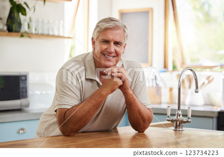 Smile, portrait and senior man in kitchen home alone in retirement. Relax, retired and elderly happy male from Canada in house, thinking and happiness with lifestyle, confidence and positive mindset. 123734223