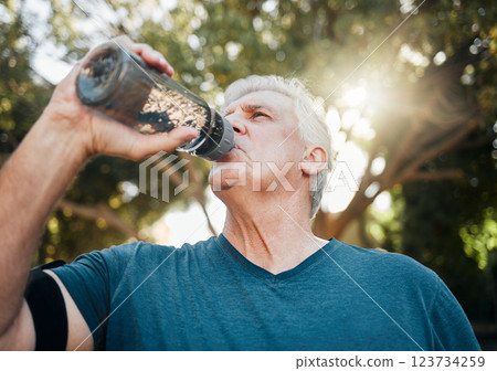 Water, nature fitness and senior man training for health in a park for body health in summer. Elderly athlete or runner with drink after cardio workout, running or outdoor sports exercise Water, nature fitness and senior man training for health in a park for body health in summer. Elderly athlete or runner with drink after cardio workout, running or outdoor sports exercise 123734259