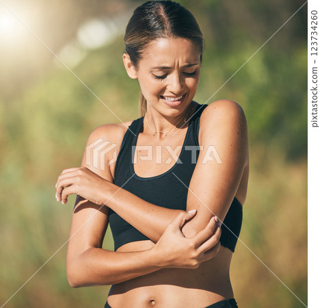 Fitness, woman and elbow in pain, injury or sports accident of runner suffering in joint ache outdoors. Athletic female holding painful area of muscle, inflammation or broken bone in discomfort Fitness, woman and elbow in pain, injury or sports accident of runner suffering in joint ache outdoors. Athletic female holding painful area of muscle, inflammation or broken bone in discomfort 123734260