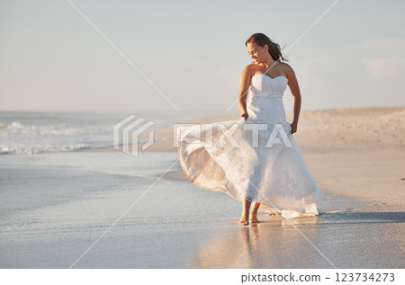 Bride walking on beach sand in wedding dress, summer event and tropical sunshine location outdoors. Happy, smile and luxury beauty woman celebrate love, marriage celebration and freedom by ocean sea 123734273