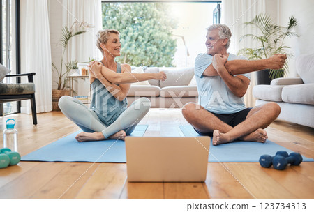 Stretching, happy morning and senior couple training with online workout in the living room of their house. Elderly man and woman doing warm up before fitness exercise with internet yoga on tech 123734313