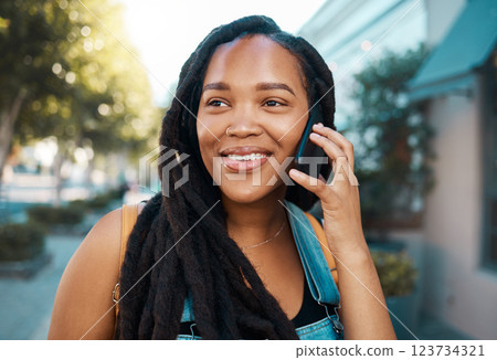 Happy black woman on the street, phone call on smartphone and talking on the pavement outside in the city. Smiling african american student, 5g mobile communication and connection for road directions Happy black woman on the street, phone call on smartphone and talking on the pavement outside in the city. Smiling african american student, 5g mobile communication and connection for road directions 123734321