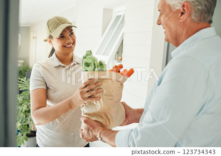 Home delivery service, fresh vegetables and customer paper bag logistics of healthy groceries at front door house. Happy woman courier giving organic grocery shopping package to senior consumer man Home delivery service, fresh vegetables and customer paper bag logistics of healthy groceries at front door house. Happy woman courier giving organic grocery shopping package to senior consumer man 123734343