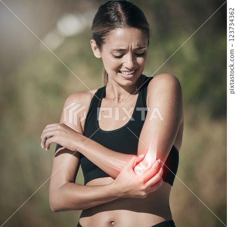 Workout woman and elbow pain from injury in joint and physical trauma from intense exercise. Athlete girl with painful, injured and broken bone from fitness training holding arm for support. 123734362