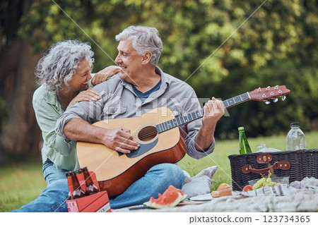 Music, guitar and a senior couple on picnic in park laughing with food, drinks and romance in retirement. Nature, love and elderly man and happy woman on romantic date on the grass on summer weekend. Music, guitar and a senior couple on picnic in park laughing with food, drinks and romance in retirement. Nature, love and elderly man and happy woman on romantic date on the grass on summer weekend. 123734365
