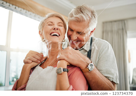 Love embrace, communication and senior couple holding hands and laughing at funny conversation in the living room of their house. Happy elderly man and woman with smile in retirement together 123734370